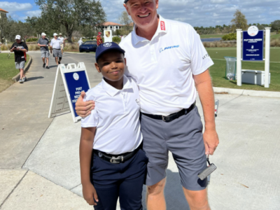 Coach and participant posing.